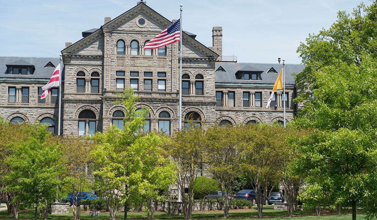 Flags in front of McMahon during the summer